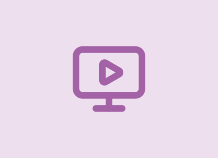 Purple computer monitor icon with a play button centered on the screen, set against a light purple background.