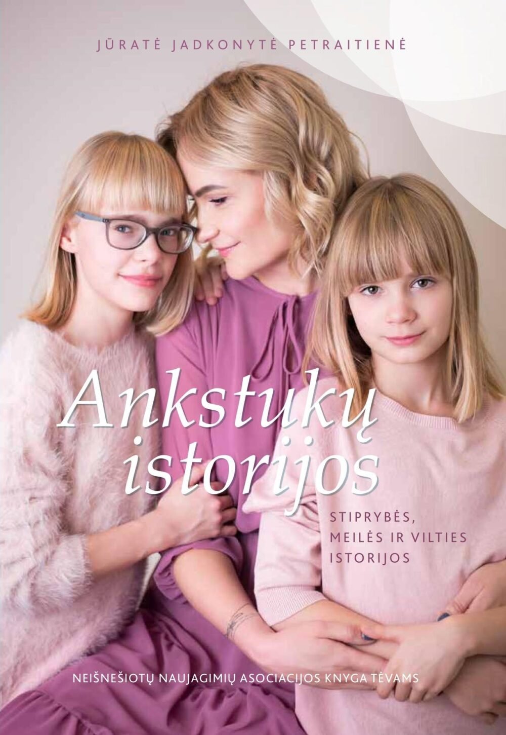 Lithuanian book cover showing a mother with two young girls in pink outfits, pastel background, white cursive title 'Ankstukų istorijos' across the front.